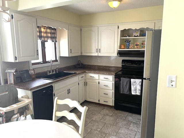kitchen featuring white cabinetry, a sink, dark countertops, and black appliances