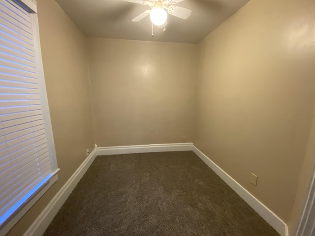 465 Miami St, Piqua, OH 45356 - empty room featuring dark colored carpet and ceiling fan