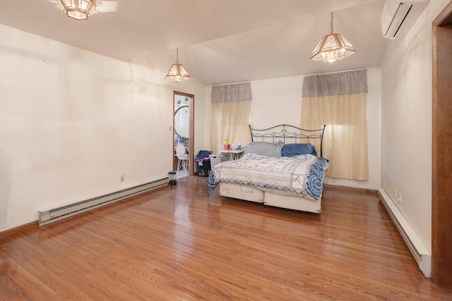 7868 Beech Ave, Russells Point, OH 43348 - bedroom with a baseboard heating unit, a wall mounted AC, light wood-style flooring, vaulted ceiling, and baseboards
