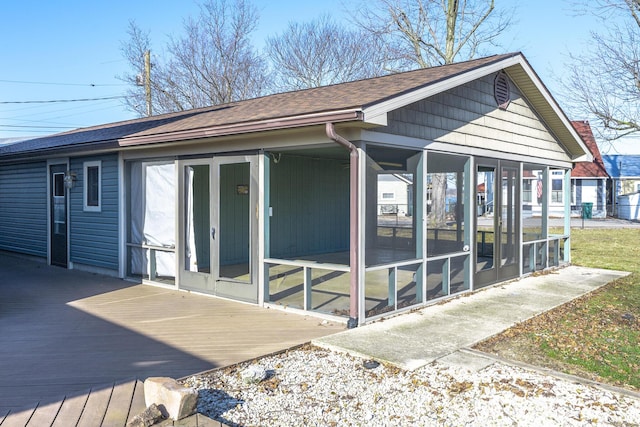 7868 Beech Ave, Russells Point, OH 43348 - view of side of property with a sunroom, a wooden deck, and roof with shingles