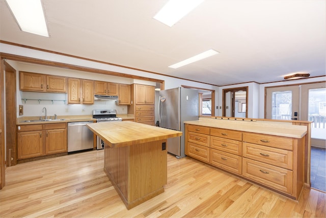 7868 Beech Ave, Russells Point, OH 43348 - kitchen featuring appliances with stainless steel finishes, wood counters, light wood finished floors, and a sink