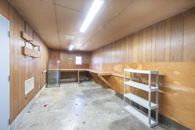 7868 Beech Ave, Russells Point, OH 43348 - misc room featuring a workshop area, concrete floors, and wooden walls
