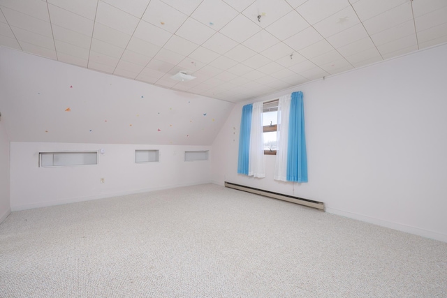 7868 Beech Ave, Russells Point, OH 43348 - bonus room featuring baseboard heating, carpet floors, lofted ceiling, and baseboards