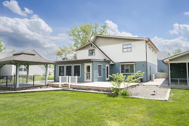 7868 Beech Ave, Russells Point, OH 43348 - back of property with a gazebo, a patio, a sunroom, and a yard