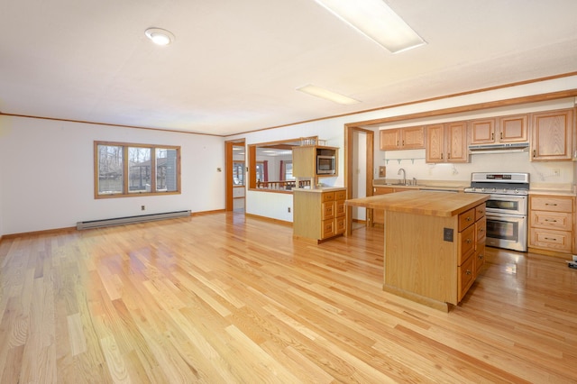 7868 Beech Ave, Russells Point, OH 43348 - kitchen featuring stainless steel appliances, baseboard heating, butcher block countertops, a sink, and under cabinet range hood