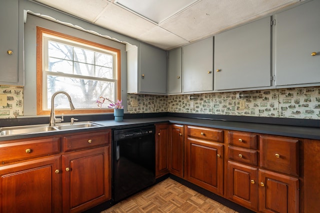 kitchen featuring brown cabinetry, dark countertops, dishwasher, and a sink