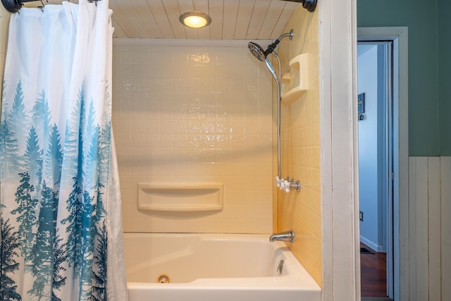 bathroom with shower / tub combo with curtain