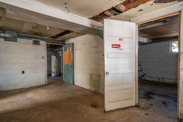 below grade area featuring gas water heater and visible vents