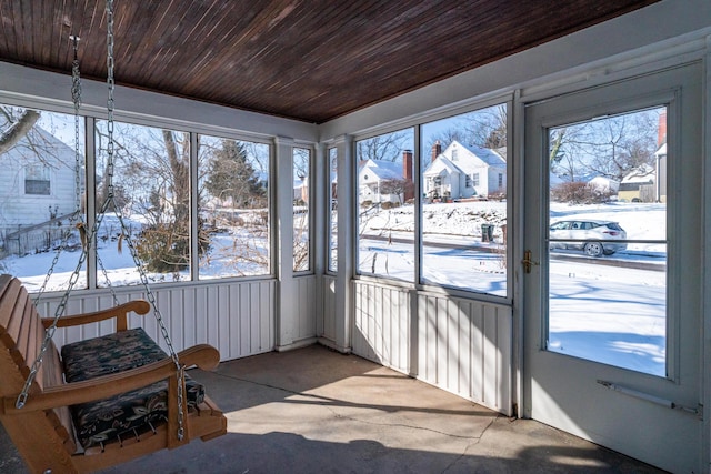 sunroom / solarium featuring wood ceiling