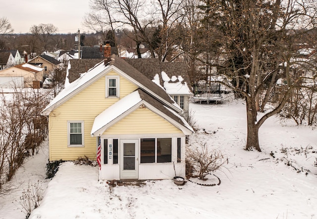 view of snow covered house