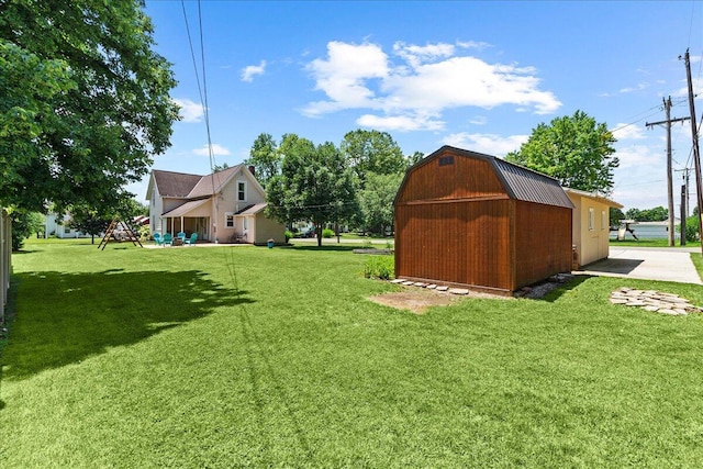 402 E Baird St, West Liberty, OH 43357 - view of green lawn with an outbuilding