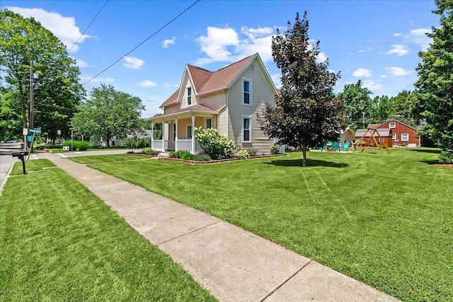 402 E Baird St, West Liberty, OH 43357 - view of front of house featuring a playground and a front yard
