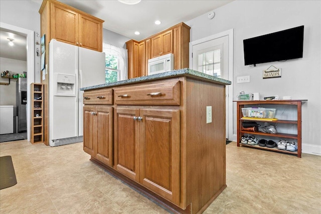 402 E Baird St, West Liberty, OH 43357 - kitchen featuring white appliances, stone countertops, and brown cabinets