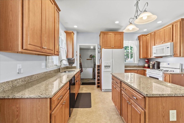 402 E Baird St, West Liberty, OH 43357 - kitchen with white appliances, light stone counters, a center island, recessed lighting, and pendant lighting
