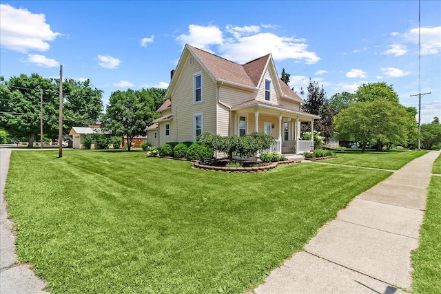 402 E Baird St, West Liberty, OH 43357 - view of property exterior featuring covered porch and a lawn