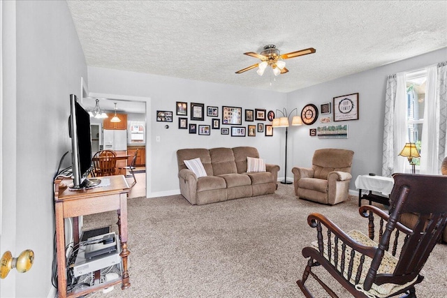 402 E Baird St, West Liberty, OH 43357 - living room featuring a ceiling fan, carpet floors, and a textured ceiling