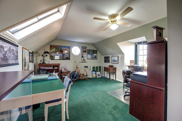 carpeted office space featuring plenty of natural light, lofted ceiling, and ceiling fan