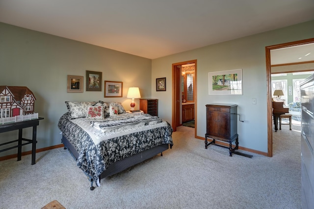 carpeted bedroom with baseboards