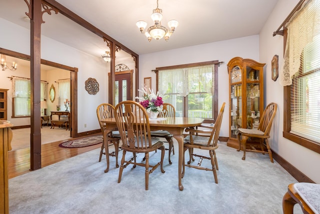 4602 State Route 273, Belle Center, OH 43310 - dining area featuring a chandelier, baseboards, and light wood finished floors