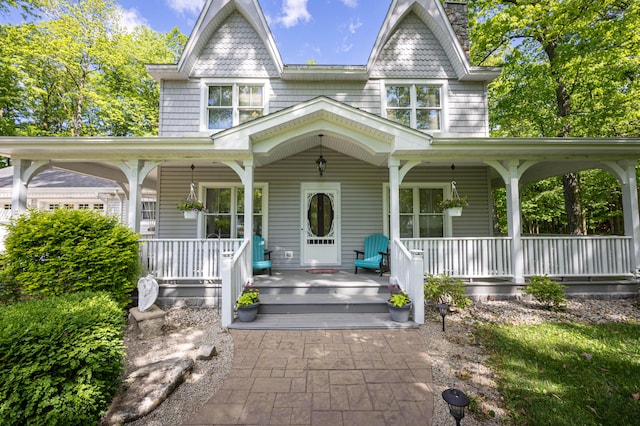 4602 State Route 273, Belle Center, OH 43310 - victorian-style house featuring covered porch and a chimney