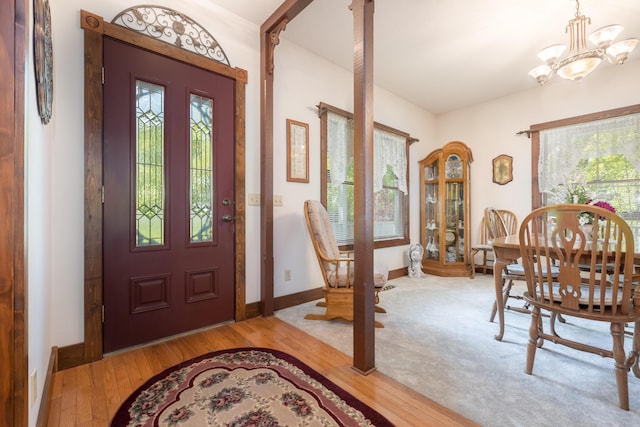 4602 State Route 273, Belle Center, OH 43310 - entrance foyer with plenty of natural light, a chandelier, and hardwood / wood-style floors