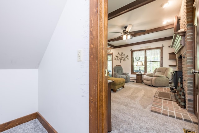 4602 State Route 273, Belle Center, OH 43310 - living room with carpet floors, a brick fireplace, ceiling fan, beamed ceiling, and baseboards