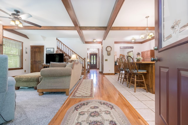 4602 State Route 273, Belle Center, OH 43310 - living area with beamed ceiling, ceiling fan, stairway, a chandelier, and light wood finished floors