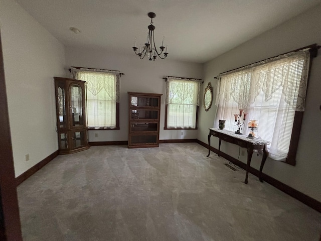 4602 State Route 273, Belle Center, OH 43310 - foyer entrance featuring a chandelier, light carpet, and baseboards