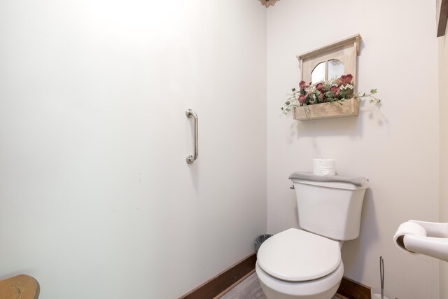 4602 State Route 273, Belle Center, OH 43310 - half bath featuring baseboards, wood finished floors, and toilet