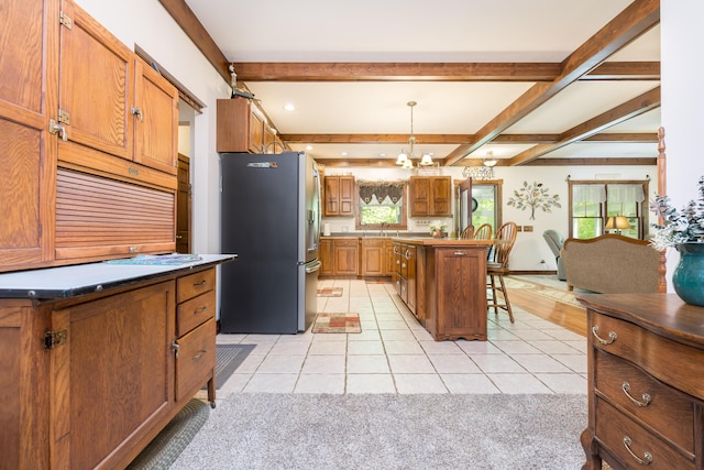 4602 State Route 273, Belle Center, OH 43310 - kitchen with stainless steel fridge with ice dispenser, a breakfast bar, light tile patterned flooring, beam ceiling, and brown cabinetry