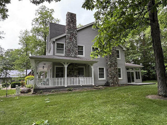 4602 State Route 273, Belle Center, OH 43310 - view of front of house featuring a front yard, a porch, and a chimney