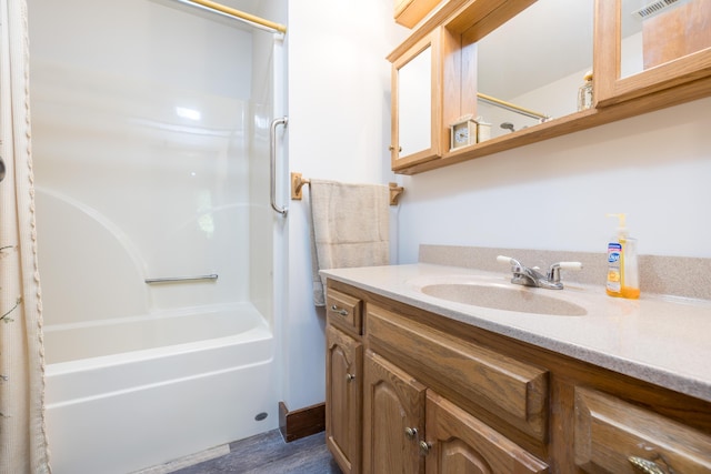 4602 State Route 273, Belle Center, OH 43310 - full bathroom featuring vanity, wood finished floors, and shower / bath combo with shower curtain