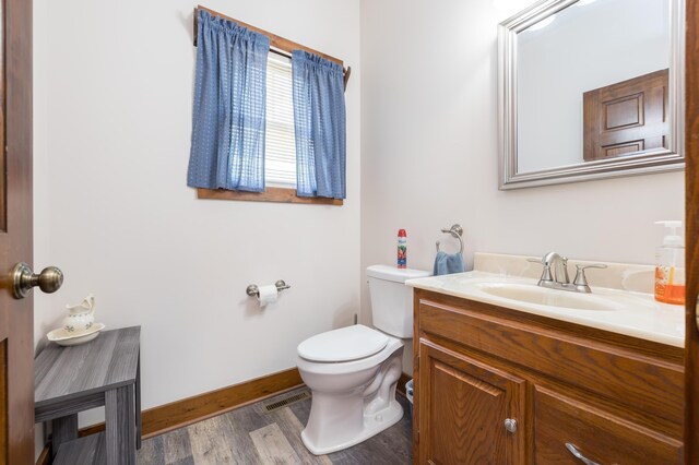 4602 State Route 273, Belle Center, OH 43310 - bathroom with toilet, vanity, wood finished floors, and baseboards