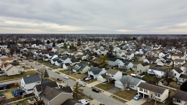 birds eye view of property with a residential view