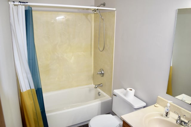 full bath with shower / bath combo, vanity, and toilet