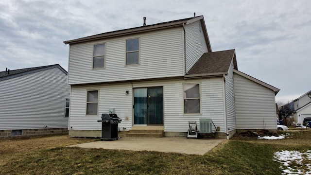 back of house featuring entry steps, cooling unit, a patio, and a lawn