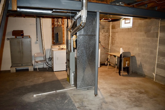 below grade area featuring washer / clothes dryer and electric panel