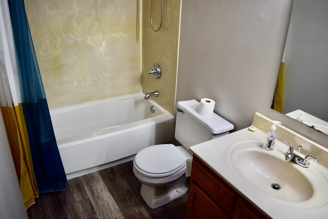 bathroom featuring toilet, shower / bath combination with curtain, wood finished floors, and vanity