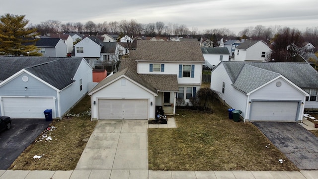 view of front of house with a shingled roof, a residential view, a garage, and a front yard