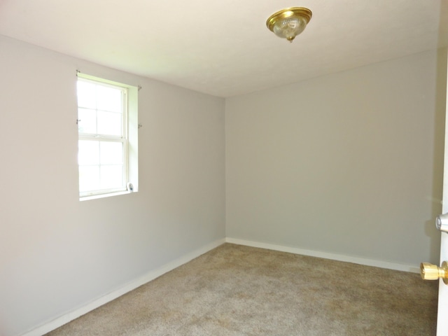 203 N Koke St, De Graff, OH 43318 - unfurnished room with light colored carpet and baseboards