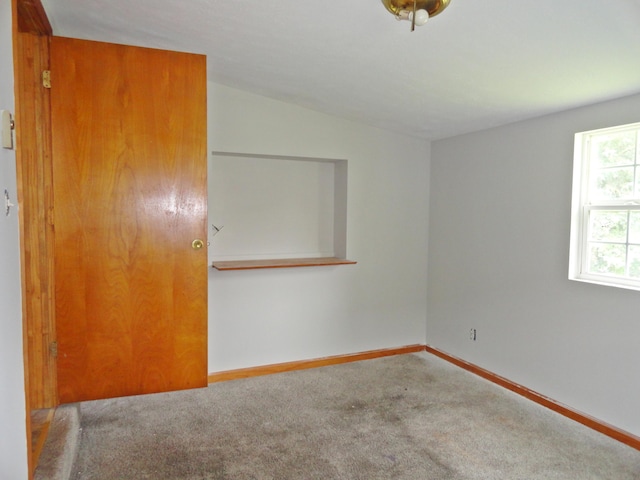 203 N Koke St, De Graff, OH 43318 - carpeted spare room featuring lofted ceiling and baseboards