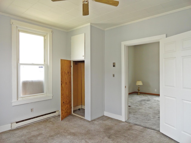 203 N Koke St, De Graff, OH 43318 - unfurnished bedroom with a baseboard heating unit, carpet flooring, ornamental molding, and ceiling fan