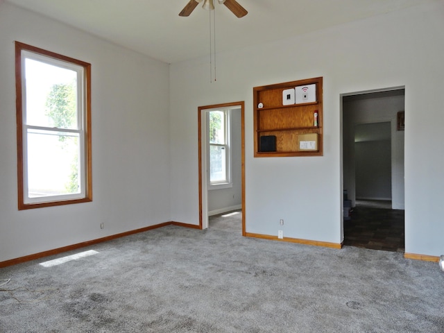 203 N Koke St, De Graff, OH 43318 - carpeted empty room with baseboards and ceiling fan