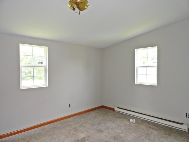 203 N Koke St, De Graff, OH 43318 - carpeted spare room with a baseboard radiator and baseboards