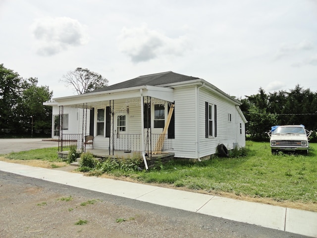 203 N Koke St, De Graff, OH 43318 - view of front of property with covered porch