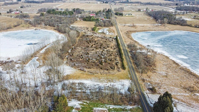 birds eye view of property with a rural view