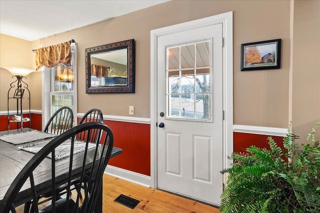 dining space featuring plenty of natural light and hardwood / wood-style floors