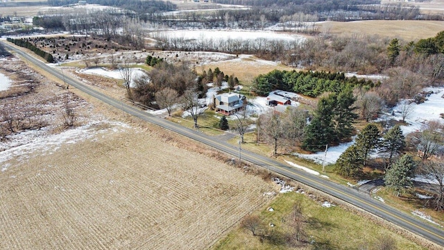 birds eye view of property with a rural view