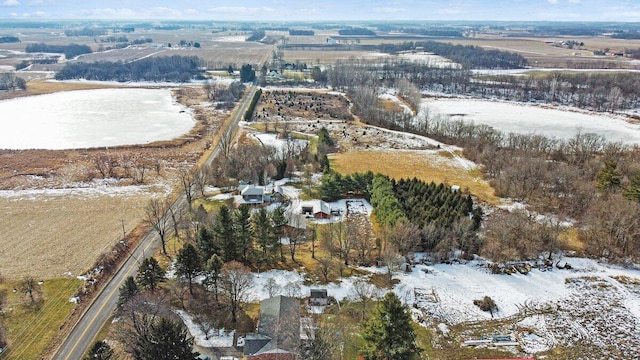 snowy aerial view featuring a rural view