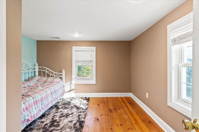 bedroom featuring hardwood / wood-style floors